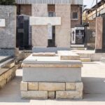 Granite tombstone artisan polishing a headstone at Tombstone Factory South Africa