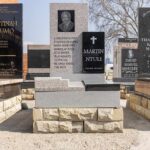 Customer viewing granite tombstone designs with consultant at Tombstone Factory showroom